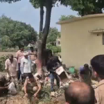 बुलंदशहर में कोर्ट के आदेश पर अवैध शराब और शस्त्र नष्ट करते पुलिस अधिकारी